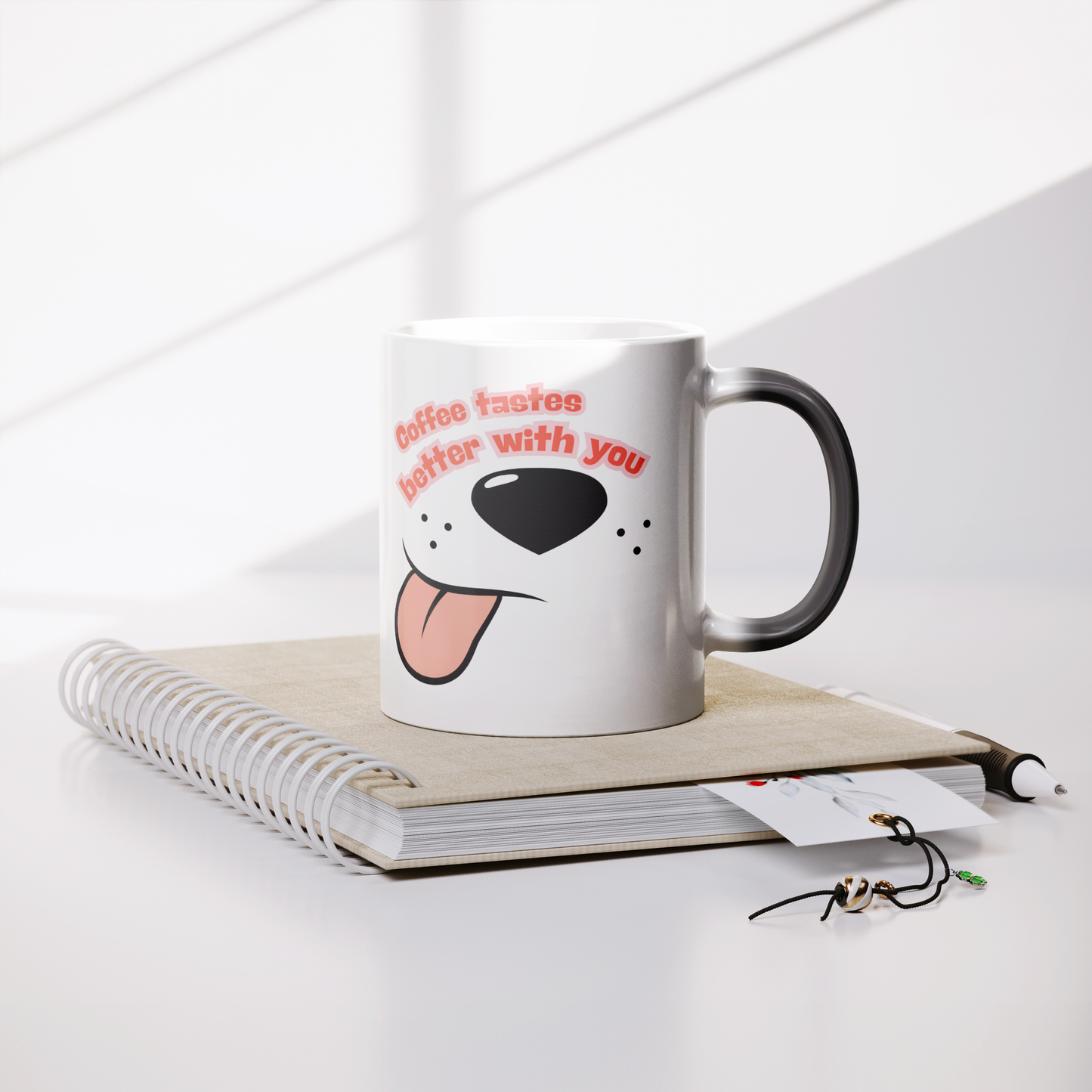 11oz_Magic_Mug_-_Coffee_Tastes_Better_W_Lifestyle_Notebook_Mockup.png
