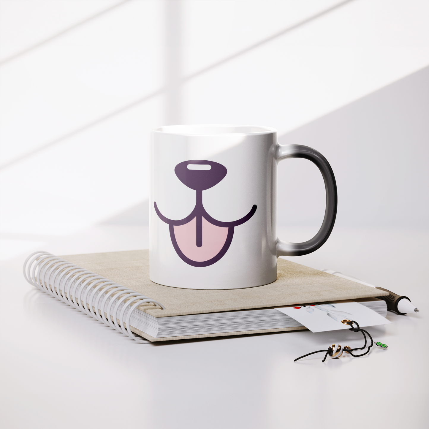 11oz_Magic_Mug_-_Tasty_Tongue_Lifestyle_Notebook_Mockup.png